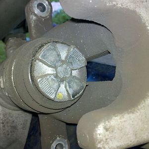 rear caliper boot needs to be cleaned/lubed (with water-based lube)