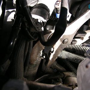 Pliers on Coolant Hose Clamp