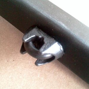 The fastener I used was a 5/8" "cable bolt" found at Lowes. It consists of a U-bolt, the cable cradle (which fits the headrest bar perfectly!), and 2
