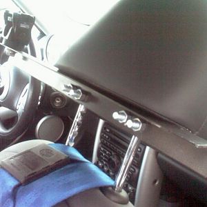 As seen from behind the seat. This is definitely not a "quick release" type. I was able to move the bracket up high enough so as not to interfere with