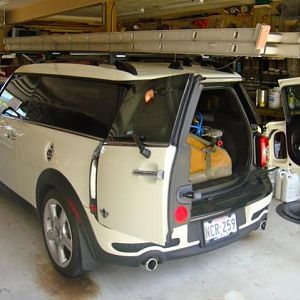 MINI Pickup truck - unloading from a work day. Yakima Rail Grab mounts & 58" bars
