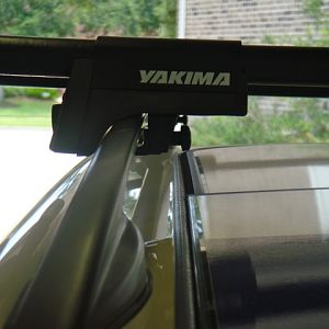 Careful where you mount the front bar. The glass Moon roof does not clear the Yakima adjustment knobs in some mount locations.