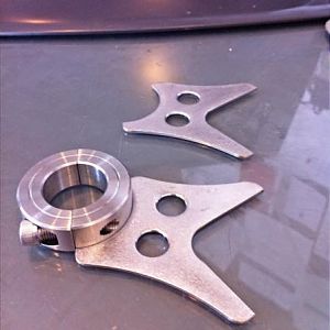 Simple SS OCC brackets I made that will get welded to standard split ring shaft collars... Holes add lightness...