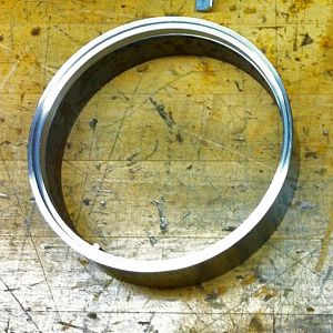 Sealing ring, 2" piece of 5" schedule 40 pipe.
Added "O" ring sealing groove.
Raw Material approximate cost $1.50 x 1