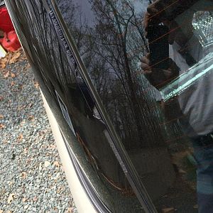 The torn up rear left trim that apparently costs $35 plus shipping to replace.